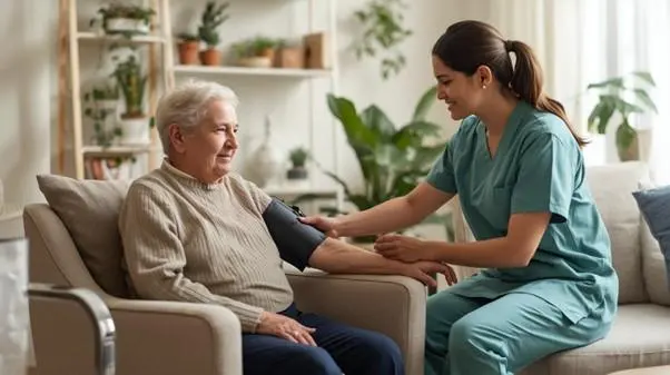 A carer sitting with a senior resident in a quiet room